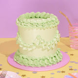 Vintage Cake - Single Colour with green Swiss Meringue icing, tall 6-layer sponge cake by Crumbs & Doilies.